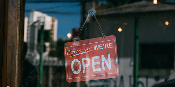 open sign hanging in window